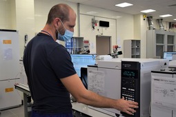 Dmitry Kabanov, representative of the supplier, performs commissioning of a stationary gas chromatography complex.